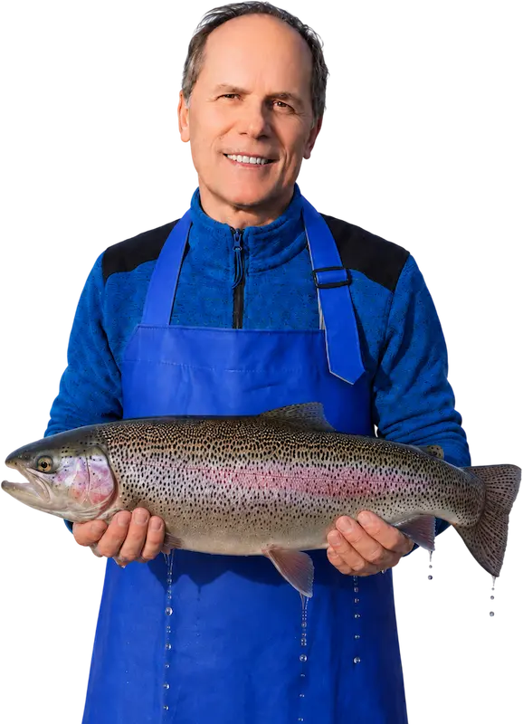 Vasily Krasnoborodko with trout at a fish farm